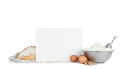 Sheet of paper with space for text and bread on white background