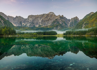 Dawn over the alpine lake Laghi di fusine in the julian alps in italy,High resolution photo