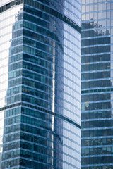 Obraz na płótnie Canvas Modern office buildings, skyscrapers with reflection in windows.