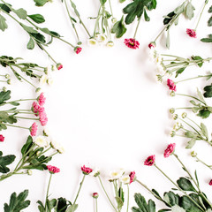 Wreath frame of red and white wildflowers, green leaves, branches on white background. Flat lay, top view. Valentine's background