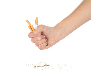 Human hand crushing cigarettes on white background