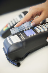 Sliding the Credit Card Through the Reader