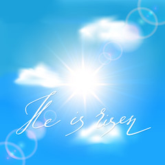 Fototapeta na wymiar Blue sky with sun and lettering He is risen