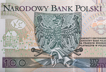 Eagle, the emblem of Poland depicted on zloty banknote macro
