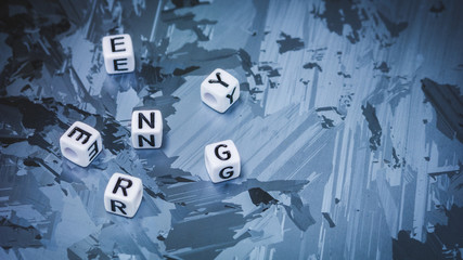 ENERGY cube letter break up randomly on solar silicon cell surface. Concept of renewable energy