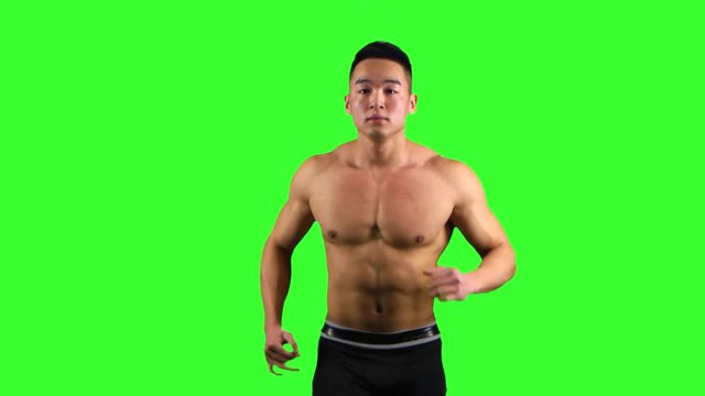 Athlete man runs on the green screen background. Front view