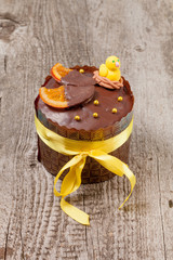 Homemade traditional Easter cake on a wooden background