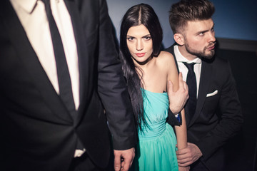 Beautiful female celebrity with bodyguards