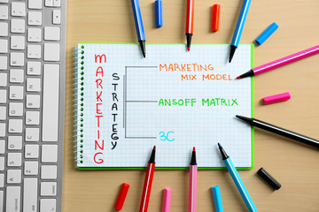 Stationery and computer on table. Marketing concept