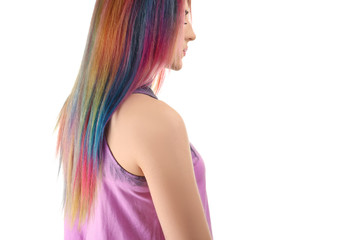 Trendy hairstyle concept. Young woman with colorful dyed hair on white background