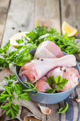 Raw chicken legs for bbc with herbs and spices