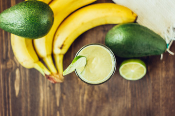 Top view of avocado banana smoothie with ingredients