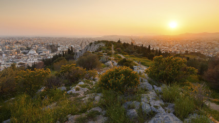 View of Athens from Filopappou hill at sunset, Greece. 
