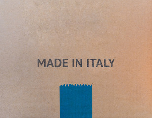 MADE IN ITALY written on brown cardboard box with copy-space for your text.