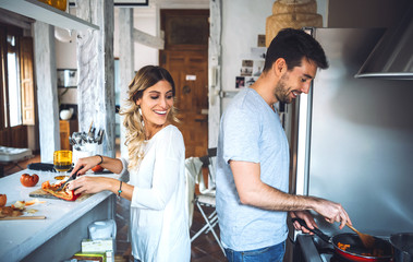 Happy couple cooking together