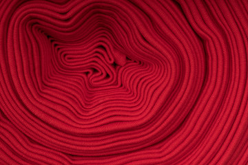 Roll of red fabric, side view