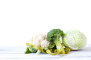 Cabbage and cauliflower with a measure. Concept diet.
