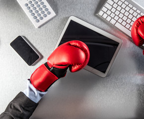 awkward businessman hands with boxing gloves multitasking on communication screens