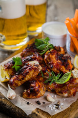 Chicken wings in on wood board