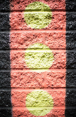 Pattern Yellow Circles Orange with Black Lines on Brick Wall Background 