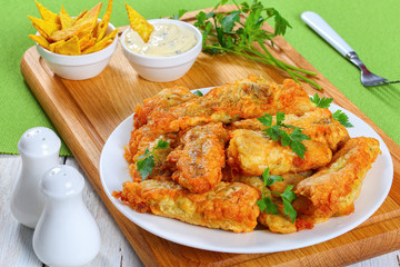 golden batter fried perch on plate