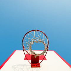 Basketball hoop against blue sky.