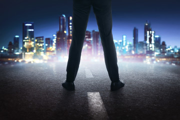 Fototapeta na wymiar Businessman feet with black leather shoes standing on the street