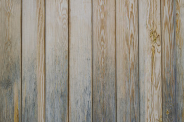 Fototapeta premium Old wooden vertical pine planks wall background texture.
