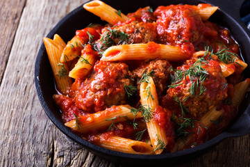 Meatball penne pasta with spicy tomato sauce and dill © istetiana