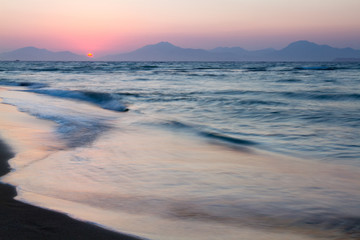 Fototapeta premium Sunset on a beach. Kos, Greece. motion.