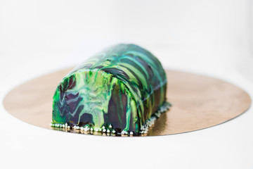 Green Mirror glaze  mousse cake. European french dessert. - 143035328