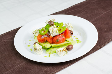 Salad With Cucumber, Tomatoes Cheese Cubes, Olives And Grilled Red Peper