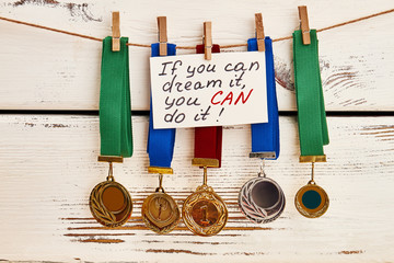 Awards on clothesline. Setting goals and going forward.