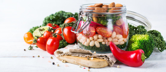 Healthy vegan salad in a mason jar with quinoa