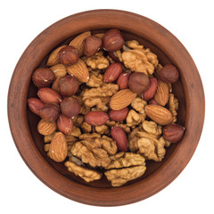 Mixture of nuts in a ceramic bowl isolated on white background.