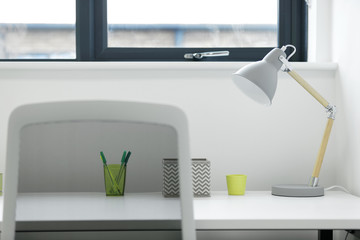 Modern office workstation with lamp