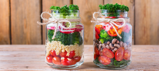 Healthy vegan salad in a mason jar with quinoa