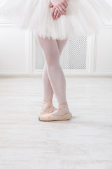 Ballerina legs closeup in fifth position