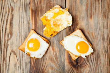 toast and egg on wooden table