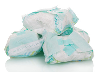 Used disposable diapers close-up isolated on white.