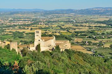 Fototapeta na wymiar Panoramic view of the historic town of Assisi and Basilica of St. Francis. Valley of Tescio, Assisi, Umbria Region, Perugia Metropolitan, Italy.