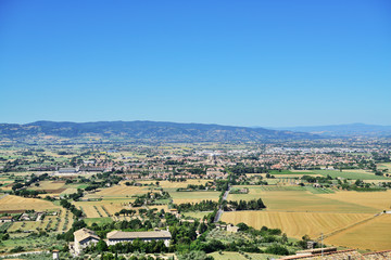 Panoramic view from historic town of Assisi and Basilica of St. Francis. to valley of Tescio and Santa Maria degli Angeli, Assisi, Umbria Region, Perugia Metropolitan, Italy.