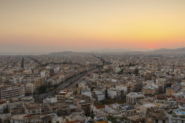 View of Athens from Filopappou hill at sunset, Greece. 

