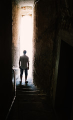 Man silhouette on stairs in narrow street