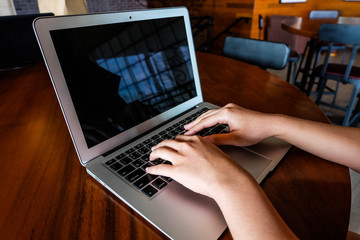 Woman office worker is typing keyboard