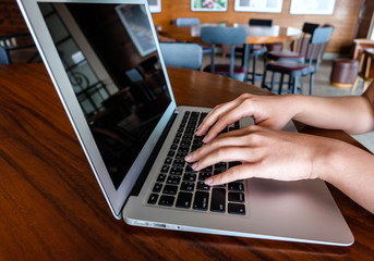 Woman office worker is typing keyboard