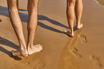 Footprint on the beach with sea wave background