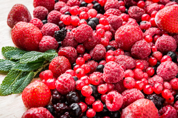 Frozen mixed berries as background.
