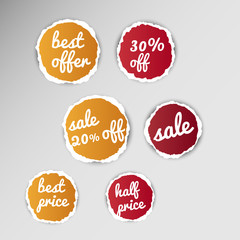 collection of torn paper sale tags