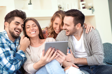 Group of friends taking a selfie at home